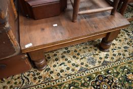 A rustic stained pine coffee table