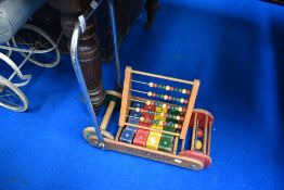 A vintage pushalong toy 'busy baby' and an abacus