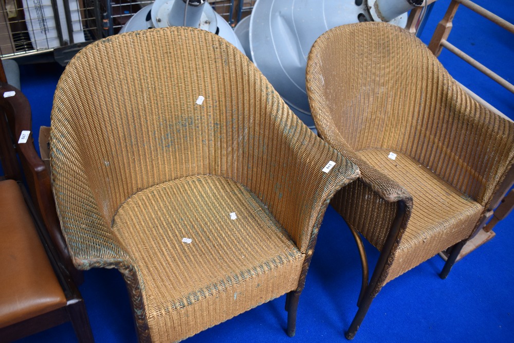 A pair of Lloyd Loom tub chairs