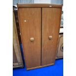 A vintage teak wardrobe , labelled EON