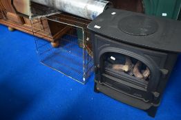A GAZCO imitation woodburner gas stove with flue fittings