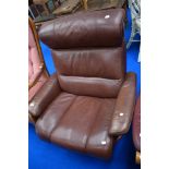 A modern Stressless recliner armchair in brown leather