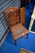 A Victorian mahogany bedroom chair and a later oak fire screen/table