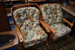 A vintage stained frame armchair and similar rocker