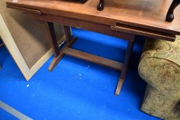 An early to mid 20th Century drawer leaf dining table having Arts and Crafts style frame