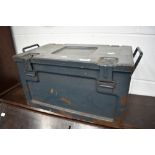 A vintage military ammo box, in airforce grey, date 1956