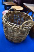 An oversized log or laundry type basket