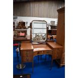 A 19th Century mahogany dressing table having large brass handles and inlaid decoration, width