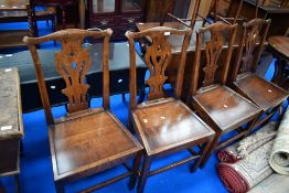 A set of four nice quality reproduction oak solid seat chairs