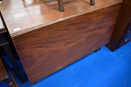 A 19th Century mahogany drop leaf dining table