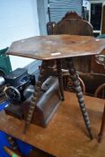 A 19th Century occasional table having walnut octagonal top , on triple bobbin turned splay legs