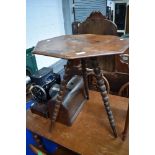 A 19th Century occasional table having walnut octagonal top , on triple bobbin turned splay legs