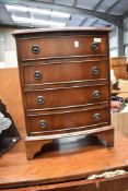 A reproduction Regency mahogany dwarf chest of four drawers