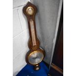 A Victorian rosewood cased onion top barometer having hygrometer, thermometer and level, with