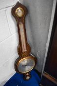 A Victorian rosewood cased onion top barometer having hygrometer, thermometer and level, with