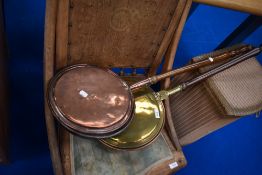 Two traditional brass and copper warming pans