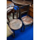 A traditional bentwood chair and a Victorian bedroom chair with ply seat