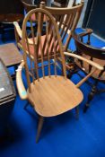 An Ercol spindle back carver chair