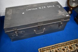 A vintage metal travel trunk, bears name for Captain NJR Sale, RGJ