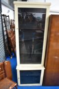 A vintage narrow painted display cabinet , possibly shop fitting