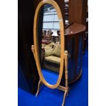 A vintage beech frame oval cheval mirror