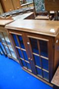 A traditional oak low bookcase/display cabinet