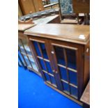 A traditional oak low bookcase/display cabinet