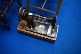A vintage Singer hand crank sewing machine