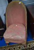 A vintage Lloyd Loom nursing chair