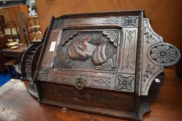 A 19th Century carved oak corner cupboard of small proportions