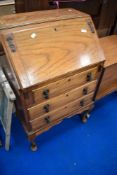 An early 20th century golden oak bureau