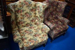 A pair of wingback armchairs in contrasting upholstery