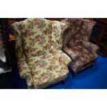 A pair of wingback armchairs in contrasting upholstery