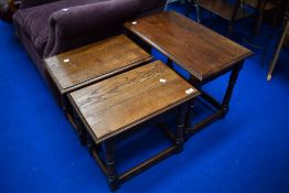 A pair of traditional Priory style occasional table in the coffin stool design