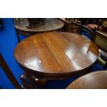 A late 19th or early 20th Century oval dining table on heavy cabriole legs, previously a wind out
