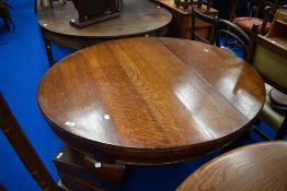 A late 19th or early 20th Century oval dining table on heavy cabriole legs, previously a wind out