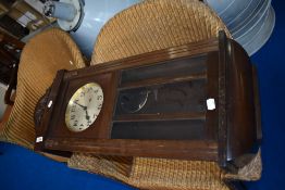 An early 20th Century mahogany cased wall clock , dial stamped with GB crown and anchor