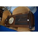 An early 20th Century mahogany cased wall clock , dial stamped with GB crown and anchor