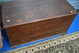 A 19th Century stained pine bedding box with drawer base