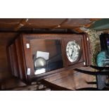 An early 20th Century oak cased wall clock