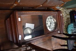 An early 20th Century oak cased wall clock