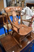 A 19th Century child's splat back rocking chair