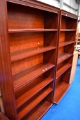 A pair of modern mahogany effect tall bookshelves