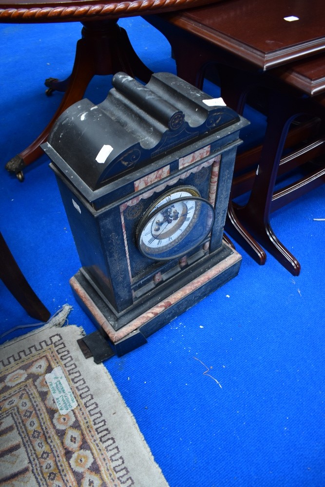 A Victorian black slate mantel clock