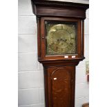 An 18th Century oak long cased clock having 8 day movement with brass dial , marked I,LL