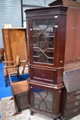 A 19th Century full height corner display with astral glazed doors and a central drop flap bureau