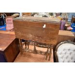 A Victorian mahogany occasional table having turned frame