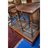 An early 20th Century oak occasional table having barley twist legs