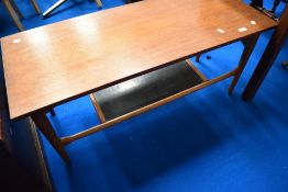 A vintage teak coffee table having slate undershelf