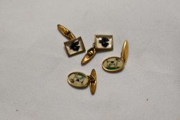 Two pairs of gold coloured cufflinks decorated with fox terriers and scottie dogs